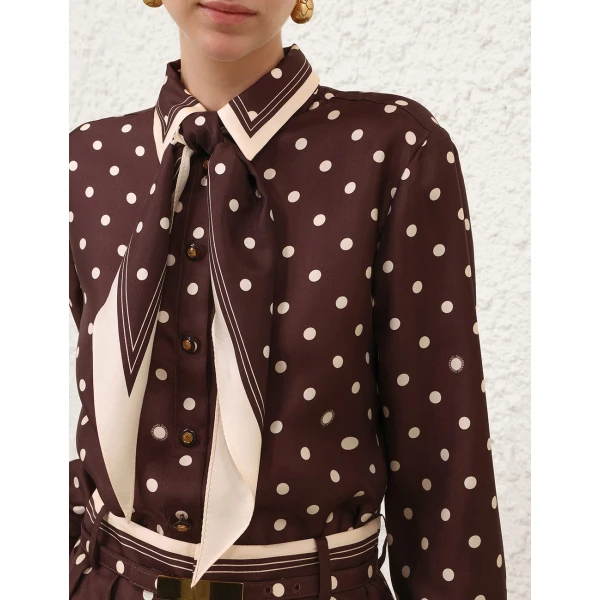Elevate your elegance in this Zimmermann Tops available now at Coveti
