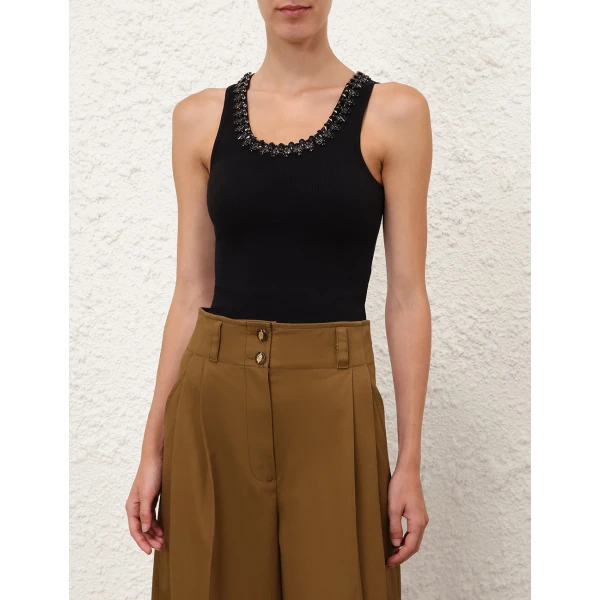 Elevate your elegance in this Zimmermann Tops available now at Coveti