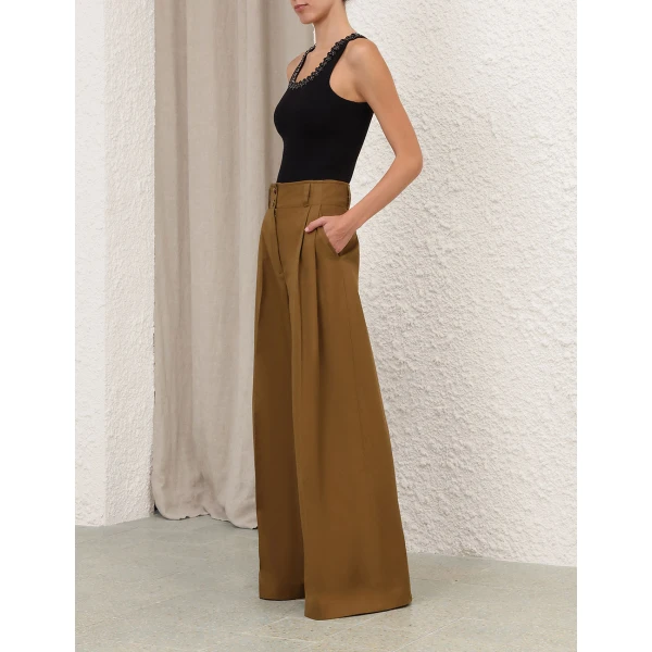 Elevate your elegance in this Zimmermann Tops available now at Coveti