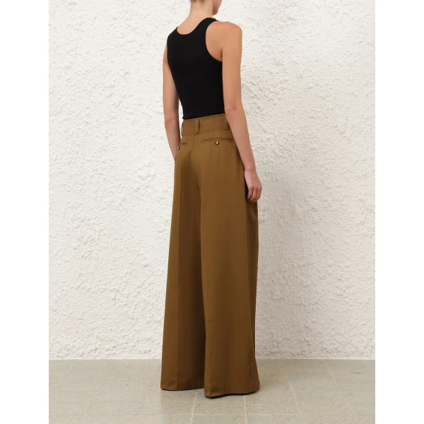 Elevate your elegance in this Zimmermann Tops available now at Coveti
