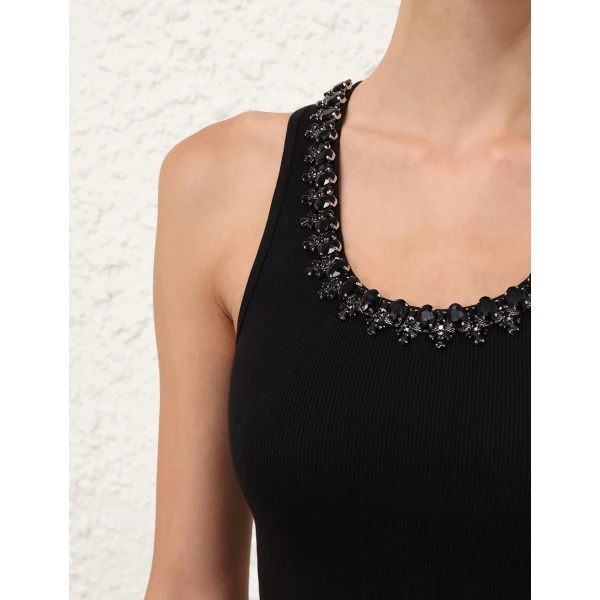 Elevate your elegance in this Zimmermann Tops available now at Coveti