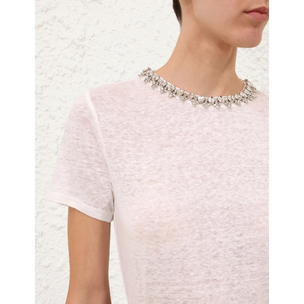 Elevate your elegance in this Zimmermann Tops available now at Coveti