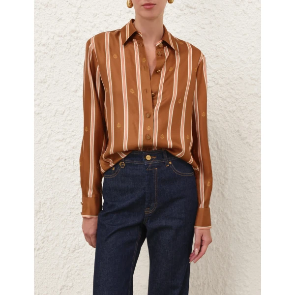 Elevate your elegance in this Zimmermann Tops available now at Coveti