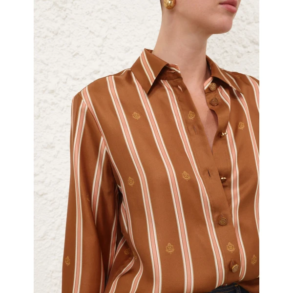 Elevate your elegance in this Zimmermann Tops available now at Coveti