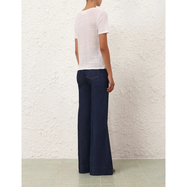 Elevate your elegance in this Zimmermann Tops available now at Coveti