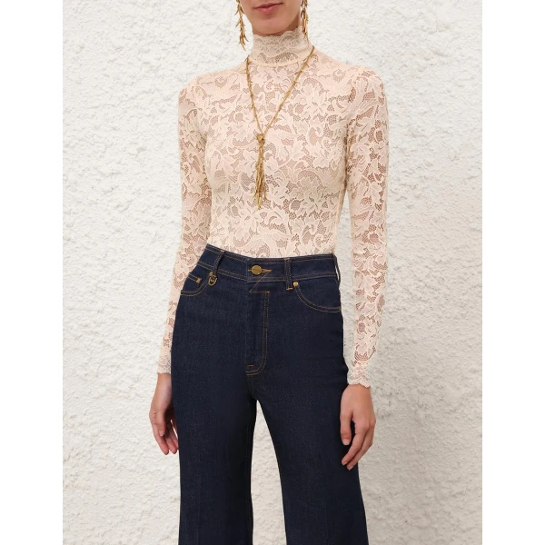 Elevate your elegance in this Zimmermann Tops available now at Coveti