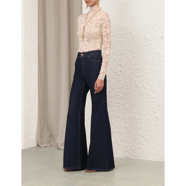 Elevate your elegance in this Zimmermann Tops available now at Coveti