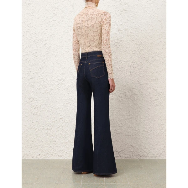 Elevate your elegance in this Zimmermann Tops available now at Coveti