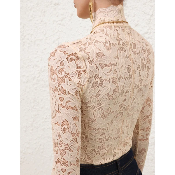 Elevate your elegance in this Zimmermann Tops available now at Coveti