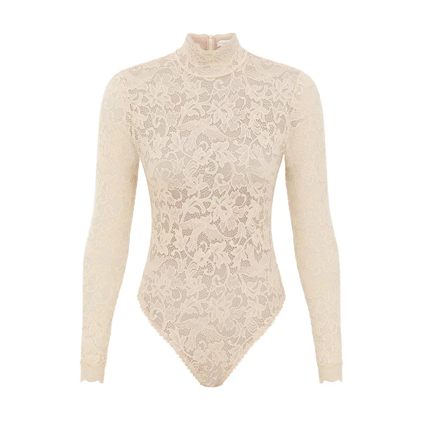 Elevate your elegance in this Zimmermann Tops available now at Coveti