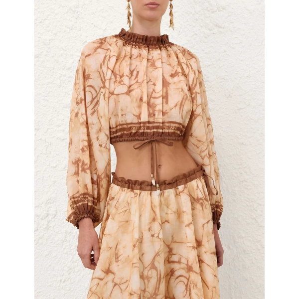 Elevate your elegance in this Zimmermann Tops available now at Coveti