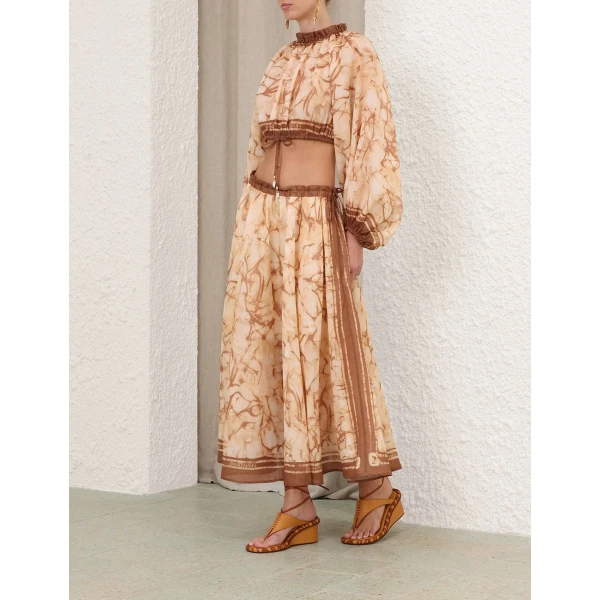 Elevate your elegance in this Zimmermann Tops available now at Coveti