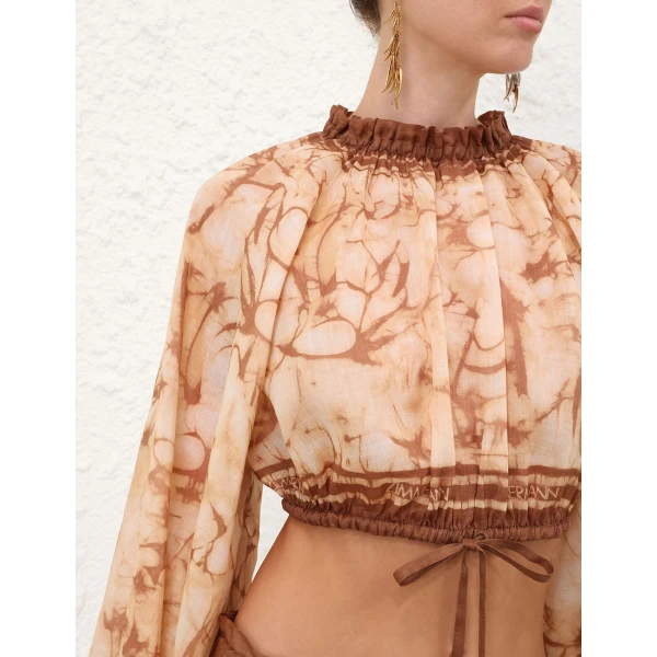 Elevate your elegance in this Zimmermann Tops available now at Coveti