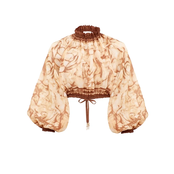 Elevate your elegance in this Zimmermann Tops available now at Coveti