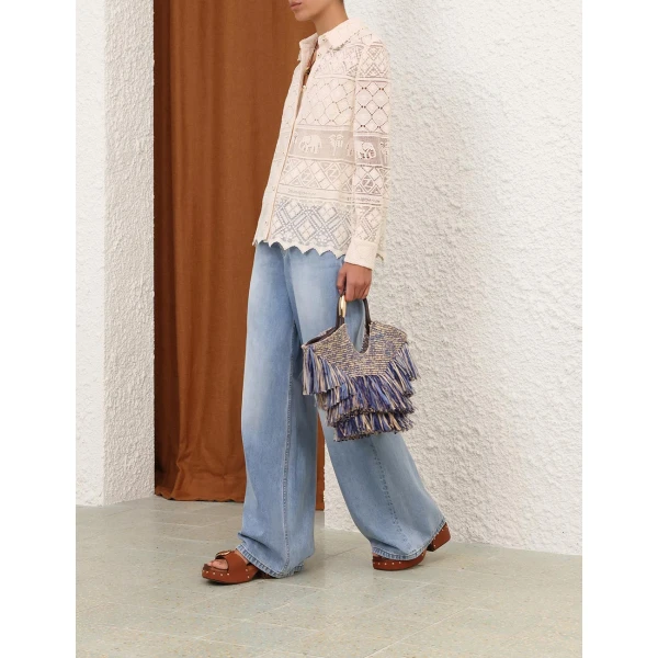 Elevate your elegance in this Zimmermann Tops available now at Coveti
