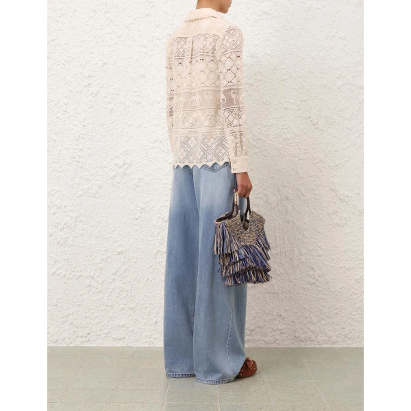 Elevate your elegance in this Zimmermann Tops available now at Coveti
