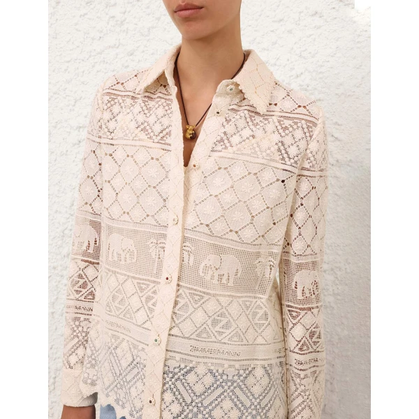 Elevate your elegance in this Zimmermann Tops available now at Coveti