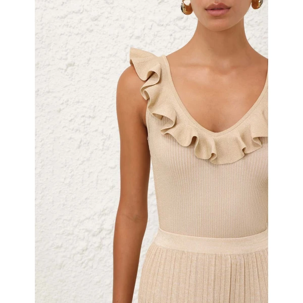 Elevate your elegance in this Zimmermann Tops available now at Coveti