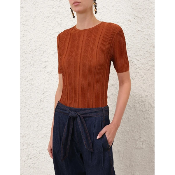 Elevate your elegance in this Zimmermann Tops available now at Coveti