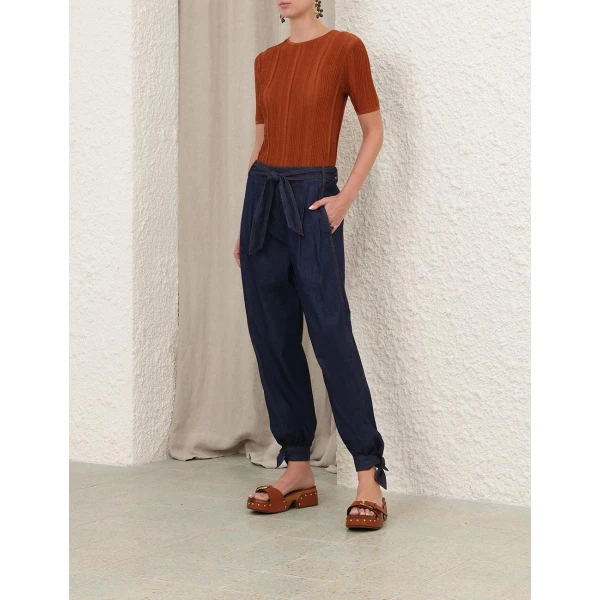 Elevate your elegance in this Zimmermann Tops available now at Coveti