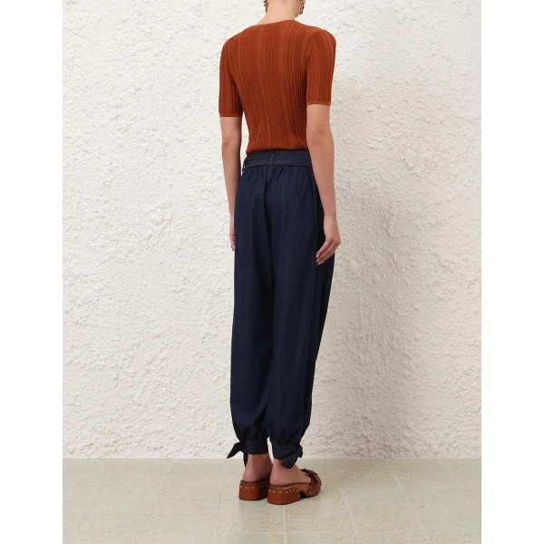 Elevate your elegance in this Zimmermann Tops available now at Coveti