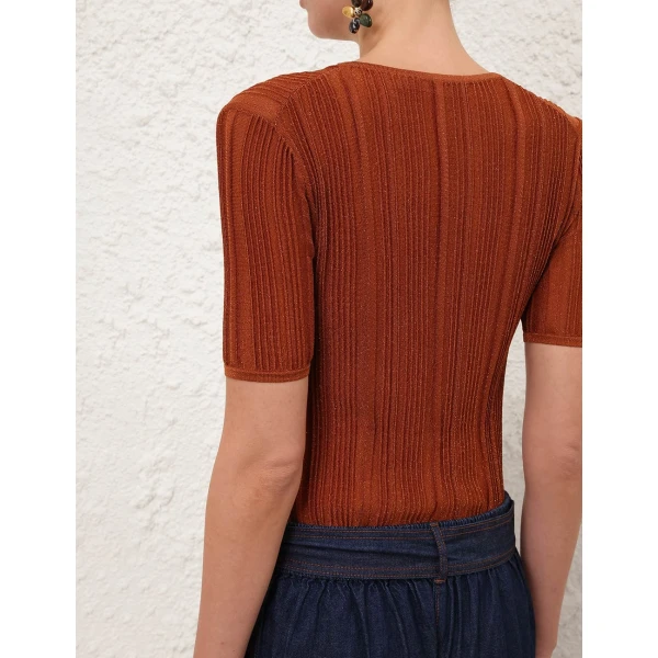Elevate your elegance in this Zimmermann Tops available now at Coveti