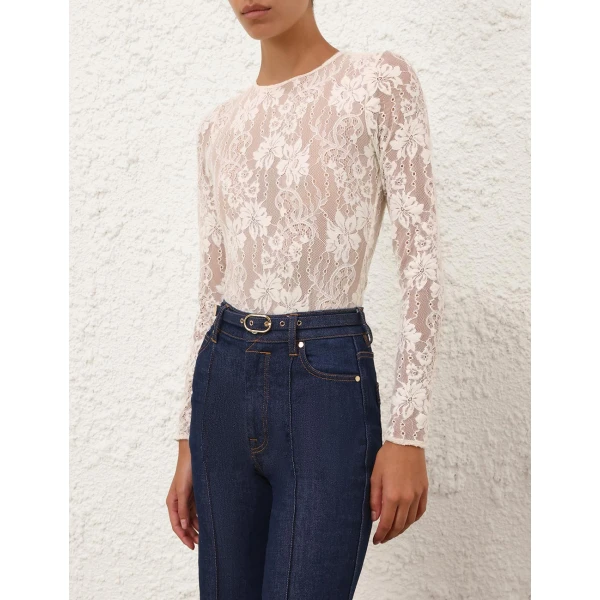Elevate your elegance in this Zimmermann Tops available now at Coveti