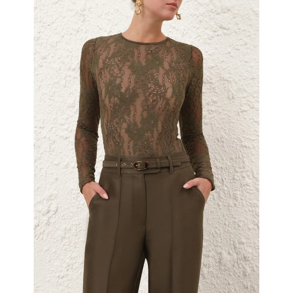 Elevate your elegance in this Zimmermann Tops available now at Coveti