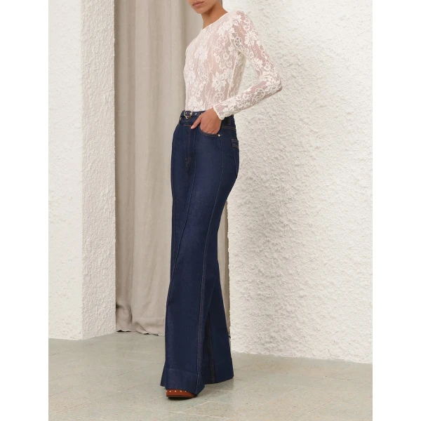 Elevate your elegance in this Zimmermann Tops available now at Coveti