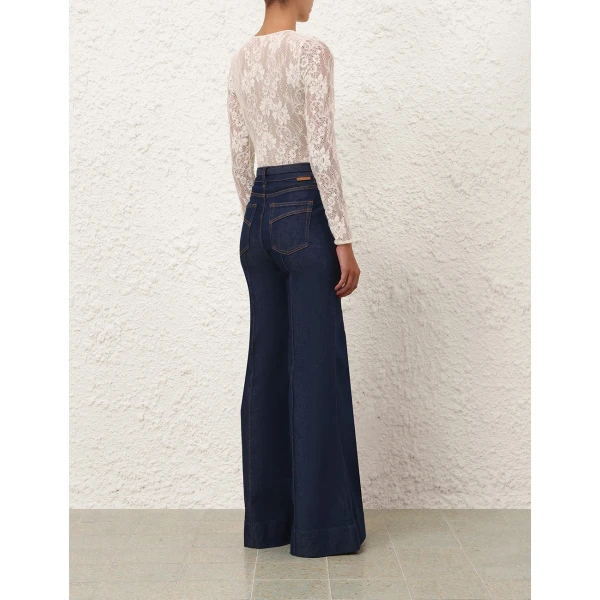 Elevate your elegance in this Zimmermann Tops available now at Coveti