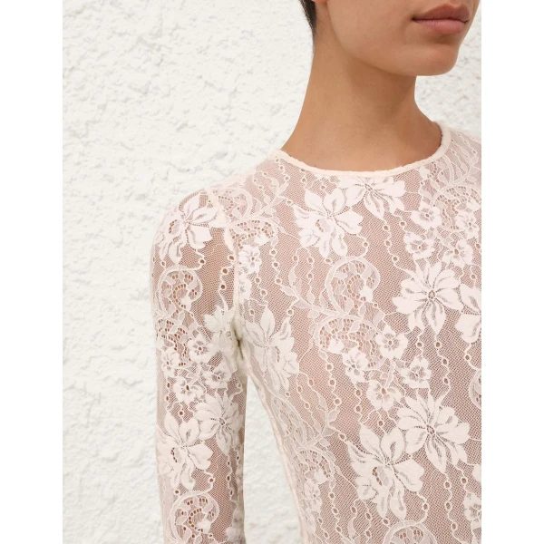 Elevate your elegance in this Zimmermann Tops available now at Coveti