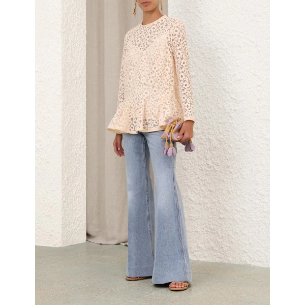 Elevate your elegance in this Zimmermann Tops available now at Coveti