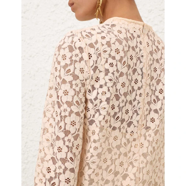 Elevate your elegance in this Zimmermann Tops available now at Coveti