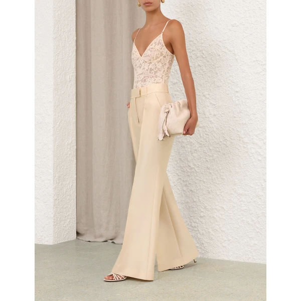 Elevate your elegance in this Zimmermann Tops available now at Coveti