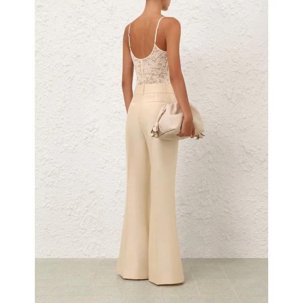 Elevate your elegance in this Zimmermann Tops available now at Coveti