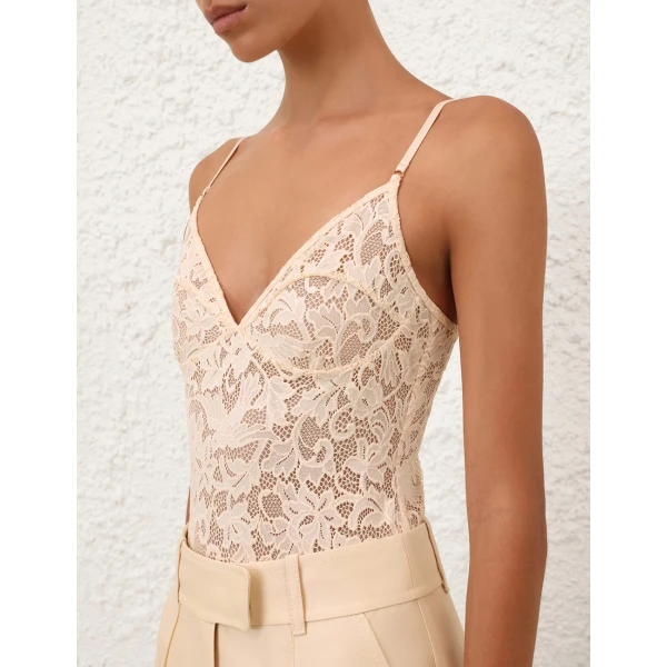 Elevate your elegance in this Zimmermann Tops available now at Coveti