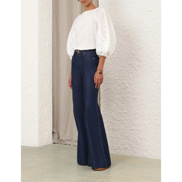 Elevate your elegance in this Zimmermann Tops available now at Coveti