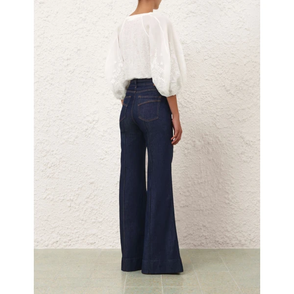 Elevate your elegance in this Zimmermann Tops available now at Coveti