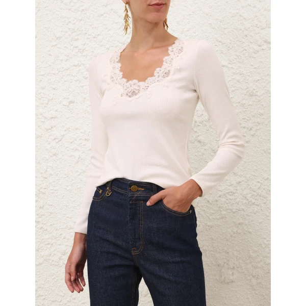 Elevate your elegance in this Zimmermann Tops available now at Coveti