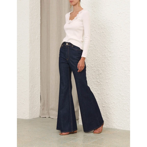 Elevate your elegance in this Zimmermann Tops available now at Coveti