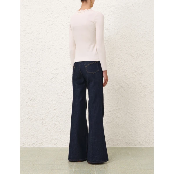 Elevate your elegance in this Zimmermann Tops available now at Coveti