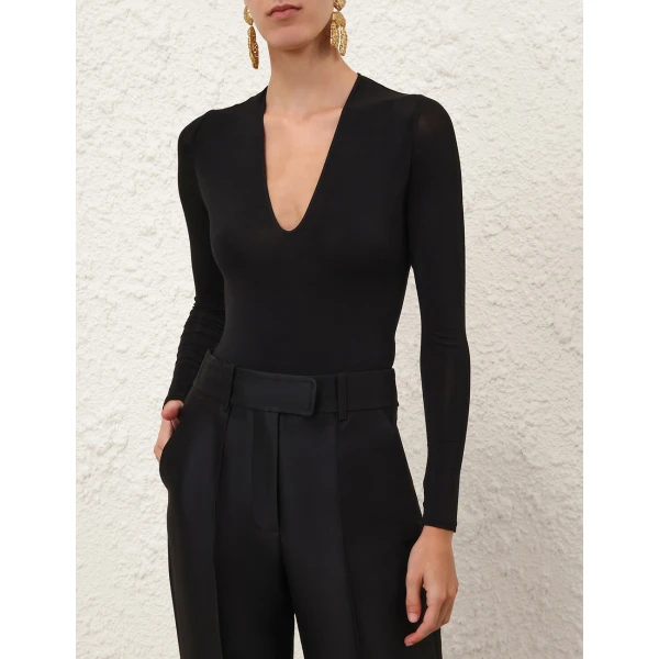 Elevate your elegance in this Zimmermann Tops available now at Coveti