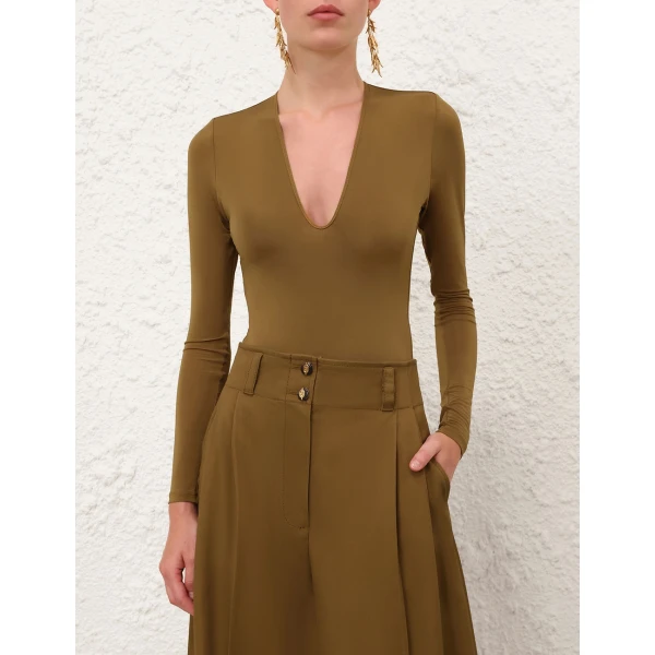 Elevate your elegance in this Zimmermann Tops available now at Coveti