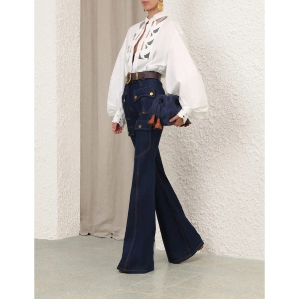 Elevate your elegance in this Zimmermann Tops available now at Coveti
