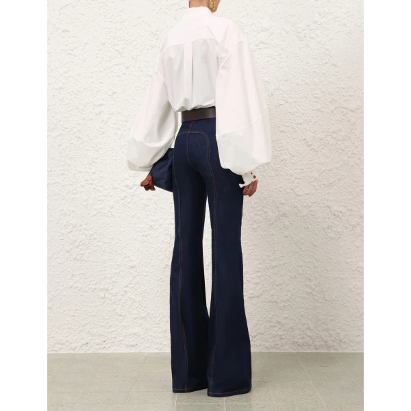 Elevate your elegance in this Zimmermann Tops available now at Coveti