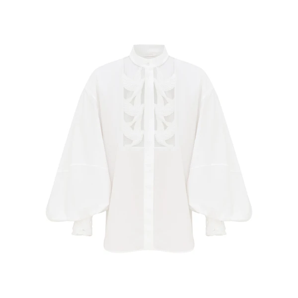 Elevate your elegance in this Zimmermann Tops available now at Coveti