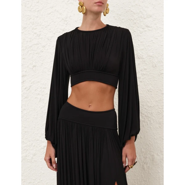 Elevate your elegance in this Zimmermann Tops available now at Coveti