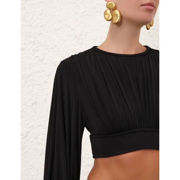 Elevate your elegance in this Zimmermann Tops available now at Coveti