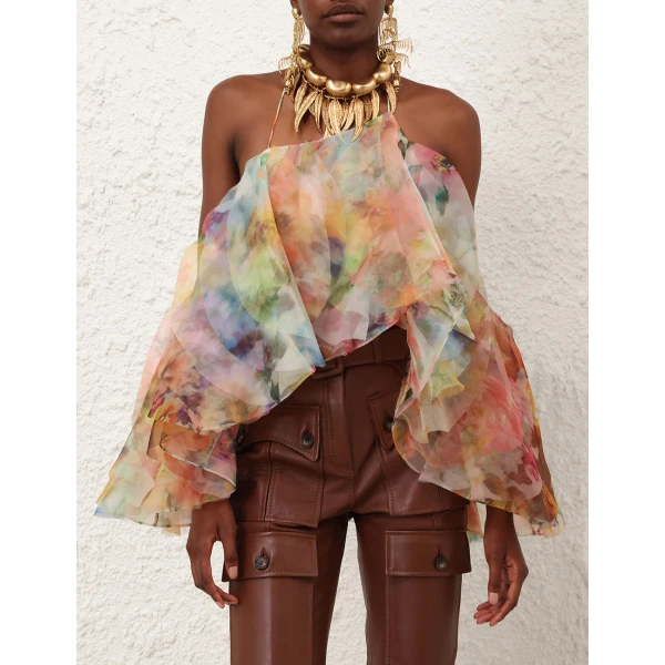Elevate your elegance in this Zimmermann Tops available now at Coveti
