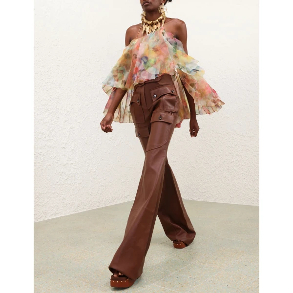 Elevate your elegance in this Zimmermann Tops available now at Coveti